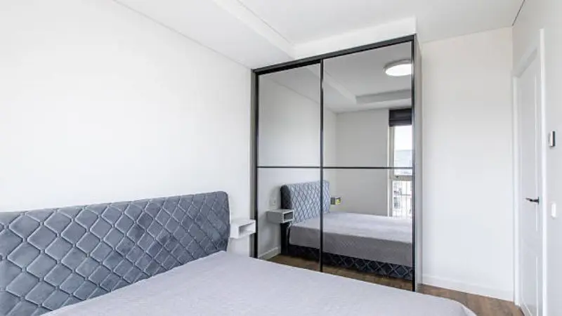 aesthetic mirrored closet doors of a bedroom