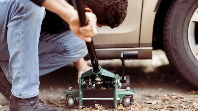 Place the floor jack under the car