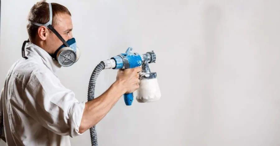 how to use a paint sprayer on walls
