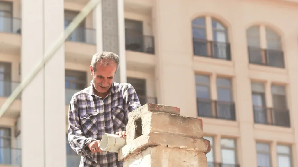 person repairing a chimney