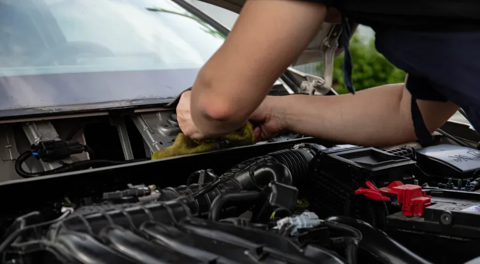 A mechanic working on a car