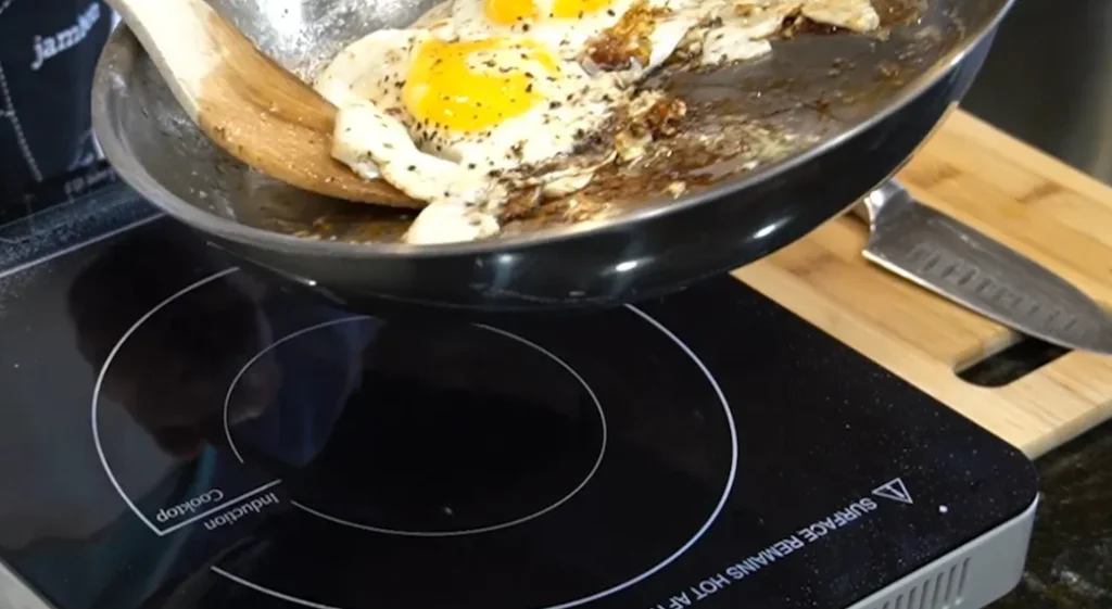 Eggs being fried on an electric stove