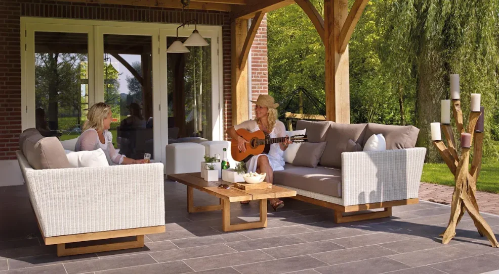 Two women singing and enjoying in a backyard patio