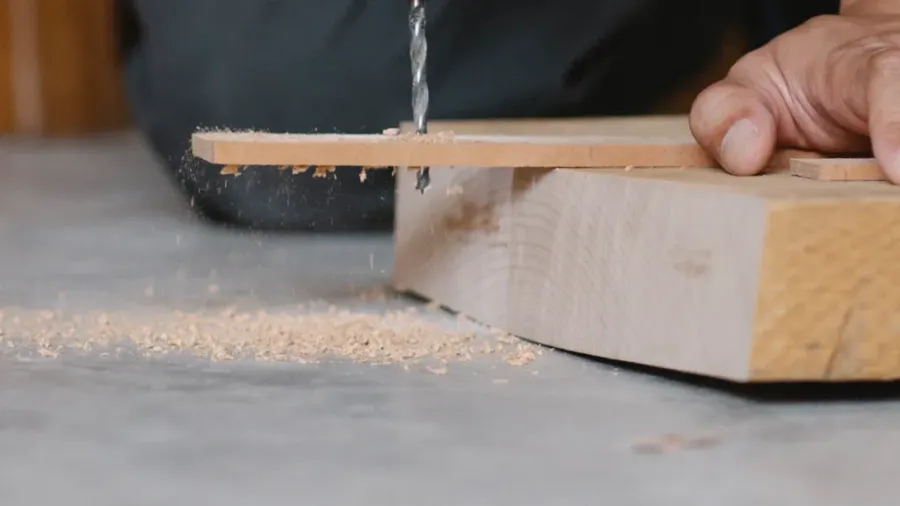 person using a pocket hole jig