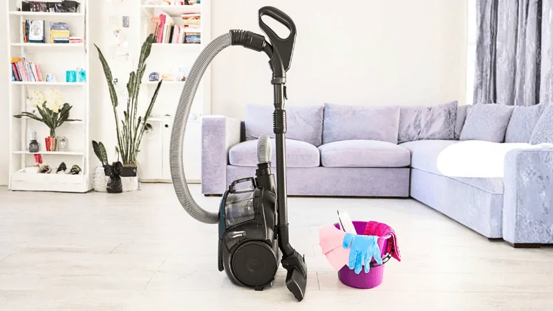 Vacuum Cleaner with a bucket placed next to it