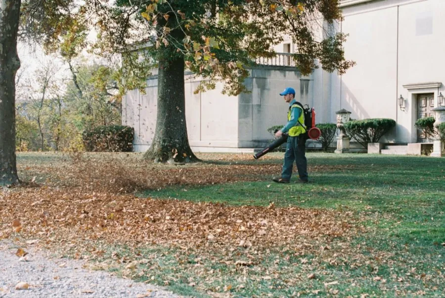 man using a gas leaf blower