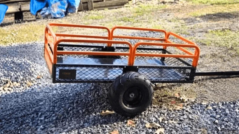 A UTV trailer being used to haul gravel