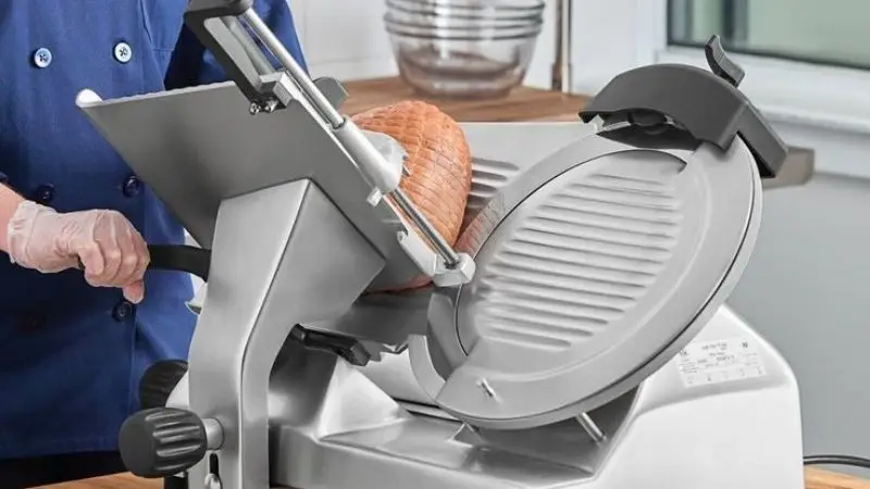 Cut meat with a slicer