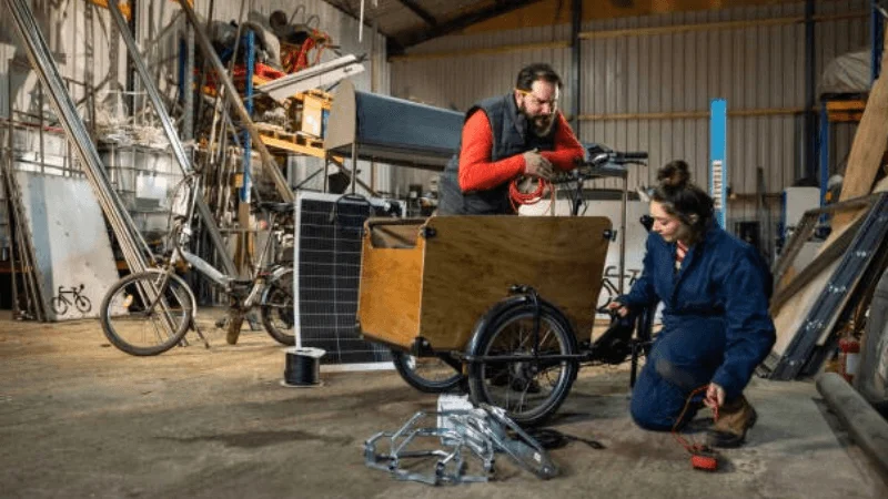 couple trying to build a DIY utility cart in their garage