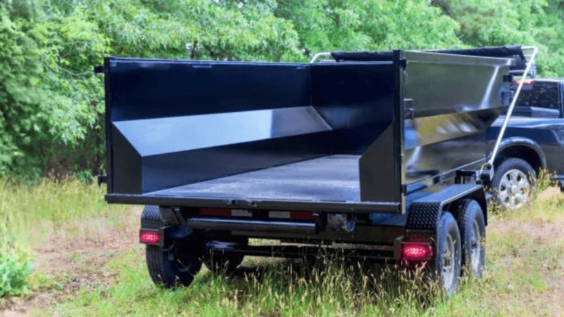 heavy duty dump trailer attached to the vehicle