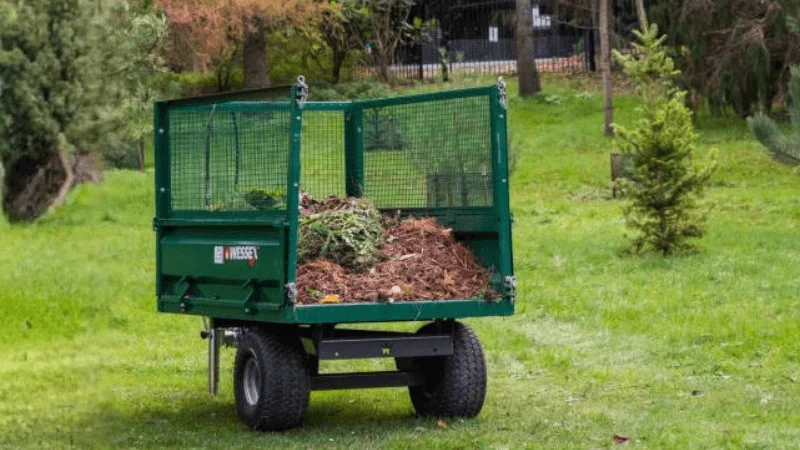 heavy-duty dump trailer being used to carry garden waste