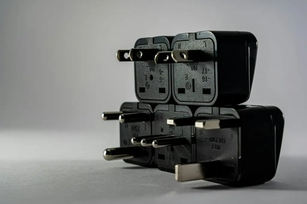Universal travel adapter with multiple plug types.