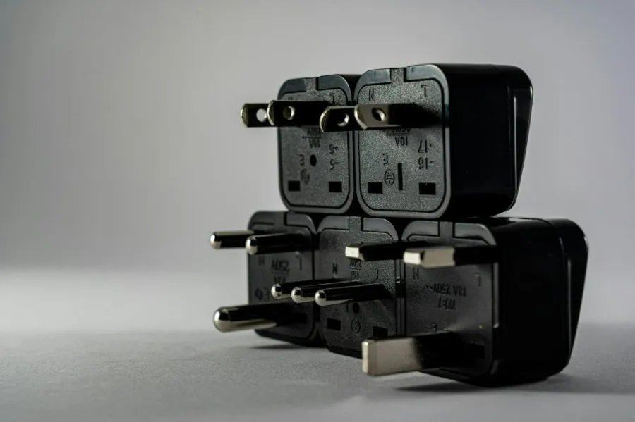 Universal travel adapter with multiple plug types.
