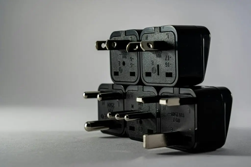 Universal travel adapter with multiple plug types.