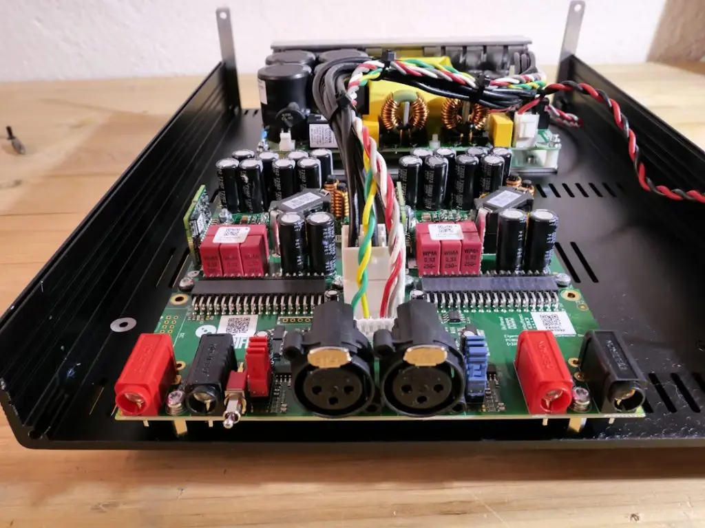 UK Type G three-pin plug adapter beside a European two-pin plug adapter