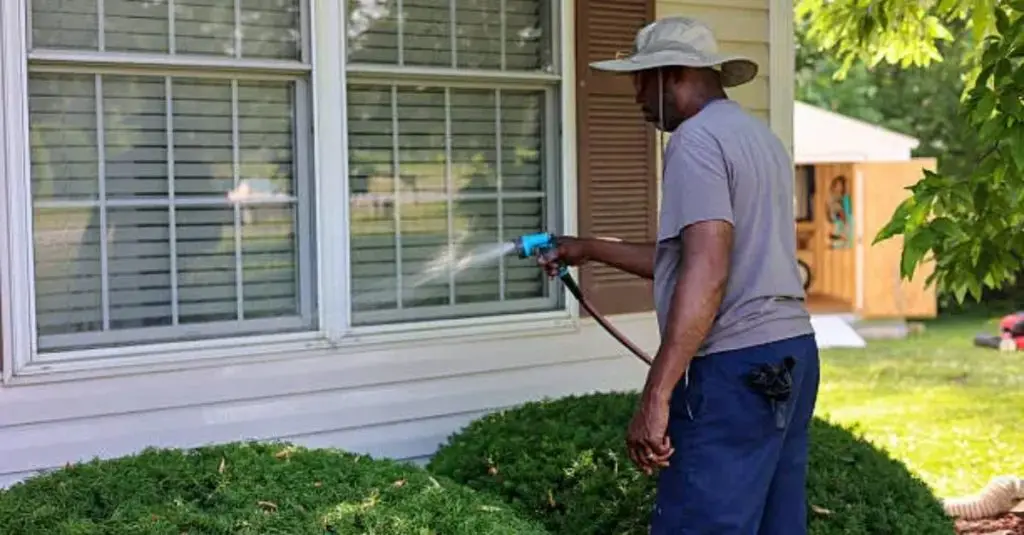 window washing with garden hose