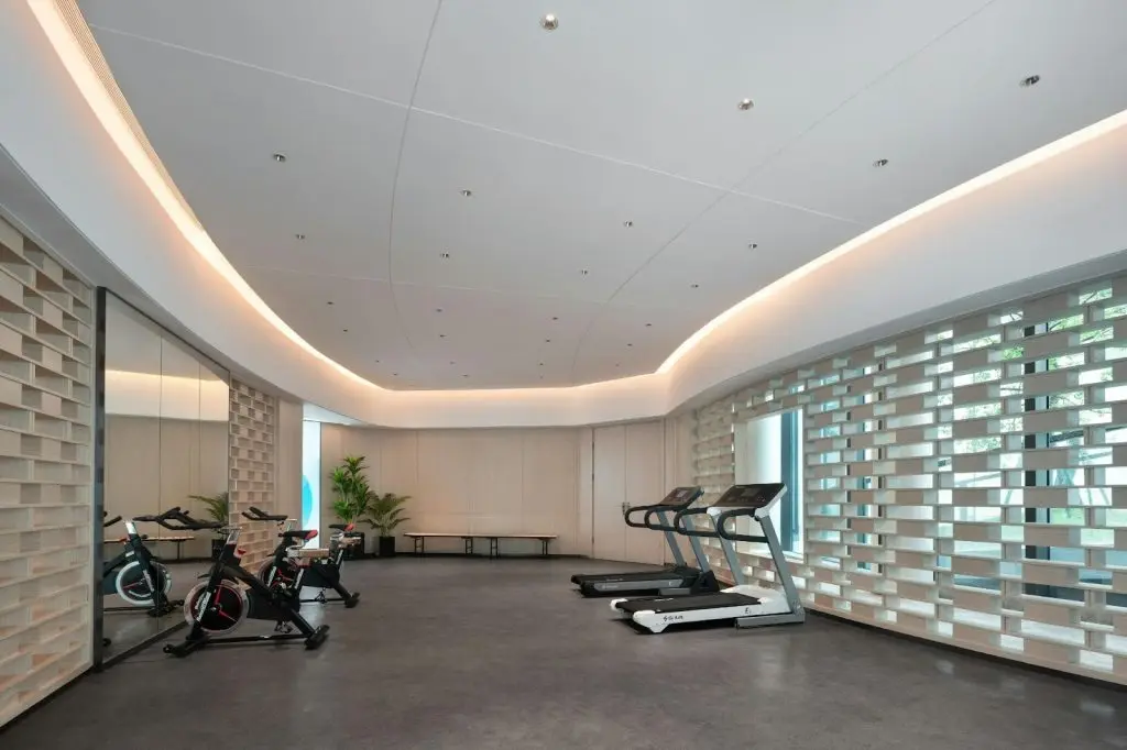 A modern home gym setup with well-maintained treadmills and clean flooring with gym equipment maintenance