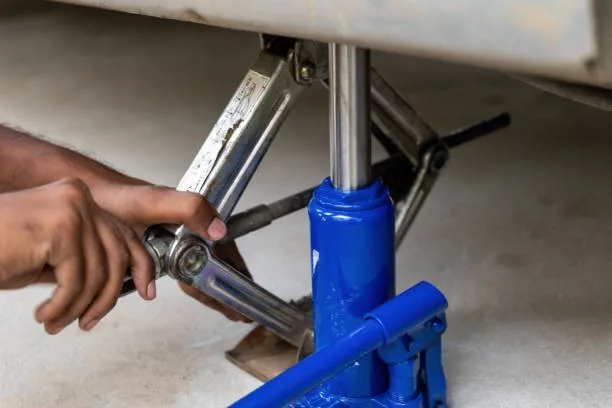 Using a bottle jack in combination with another type of rack for additional support