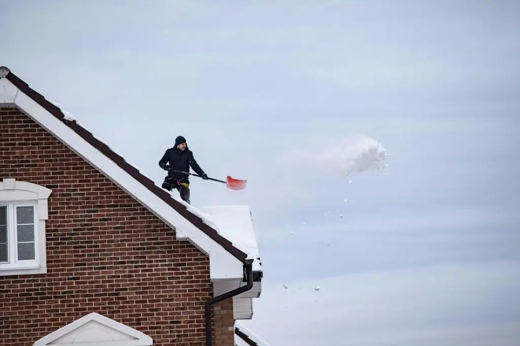 removing excess ice from roofs with rack