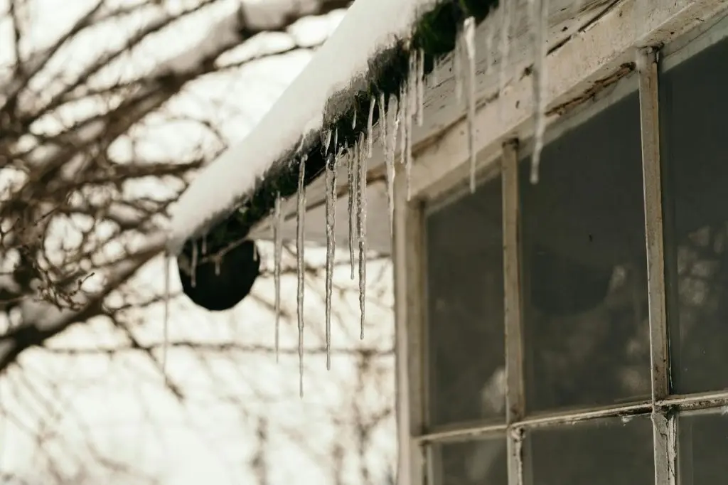Clear ice dams from gutters