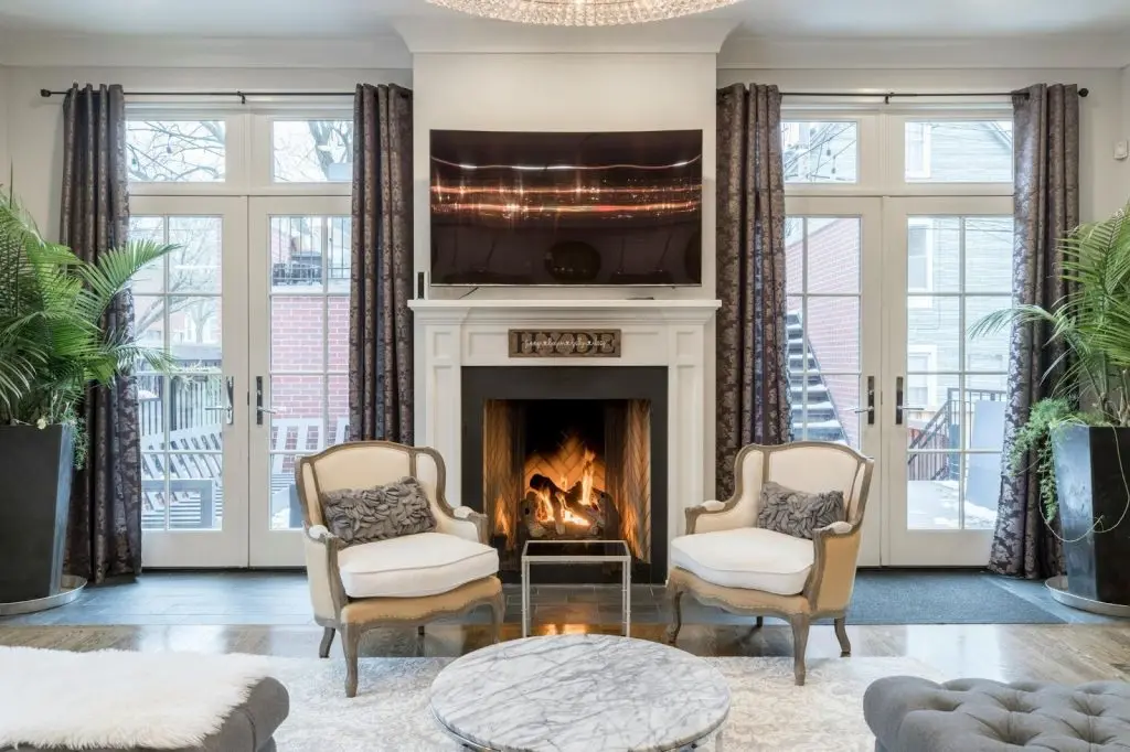 A cozy living room with a glowing fireplace providing warmth during a cold day