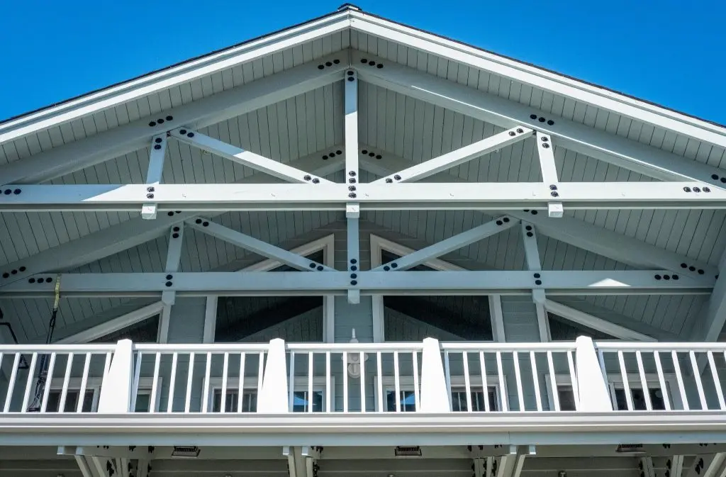 Front view of a residential steel beam installation showing exposed steel beams in the structure.