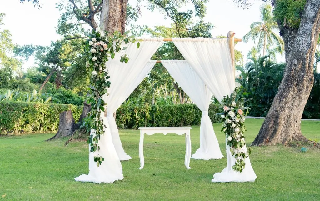 Wedding arch with white curtains