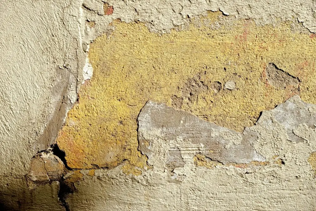 Bad basement walls with paint cracking