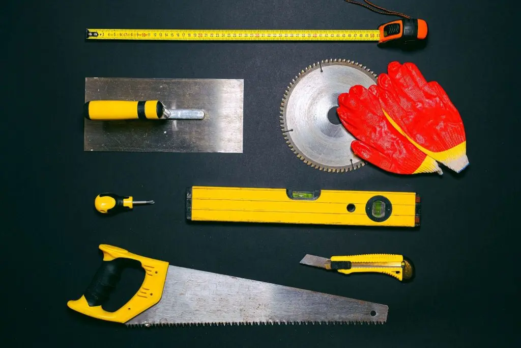 basement repair tools spread over a flat surface.