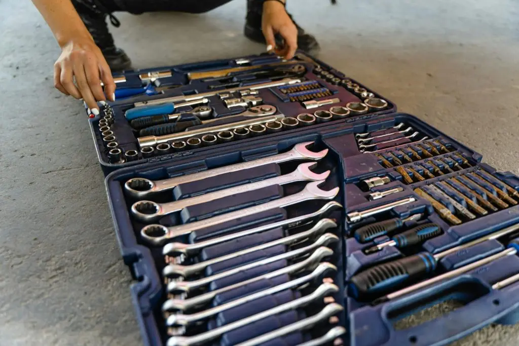 Small home tool kit with precisely organized hand tools in a custom-molded storage case.