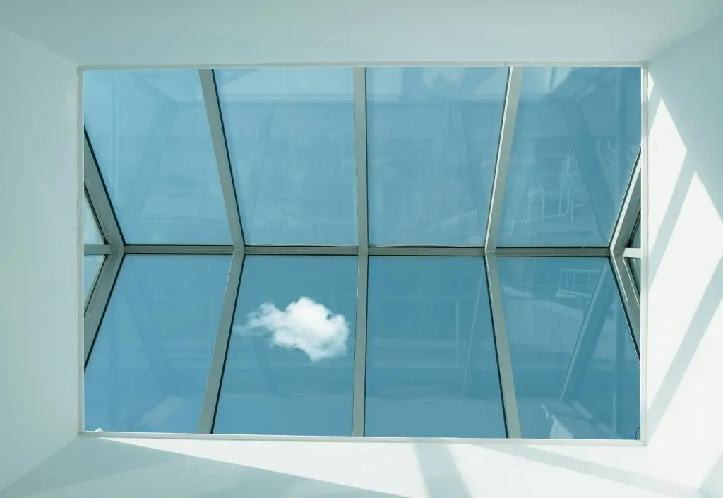 Skylight installation with blue skies and clouds