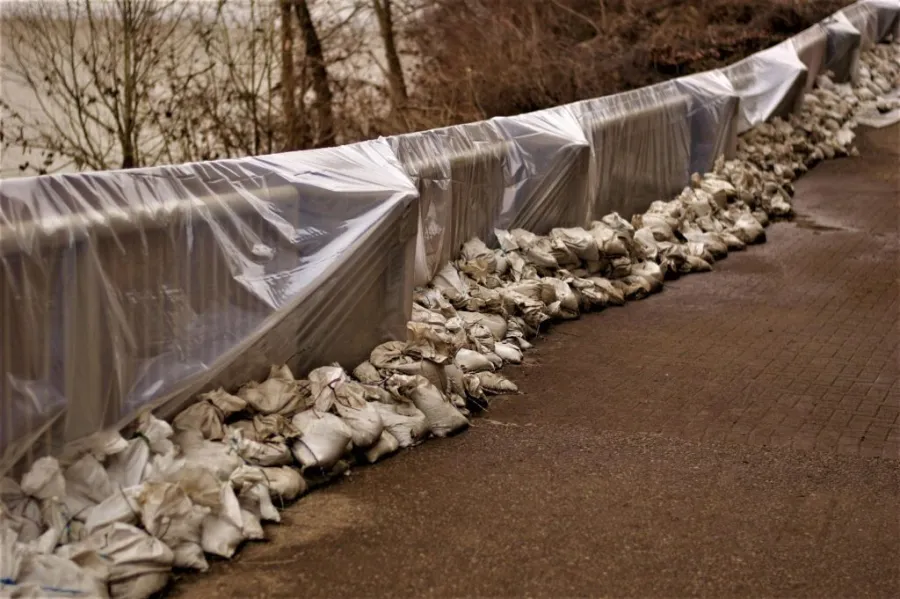 Hand rails completely coated with plastic sheets to act as a vapor barrier.