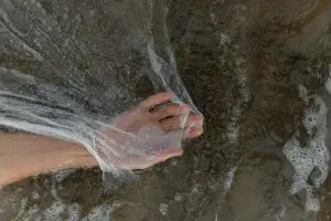 plastic sheet in a pond