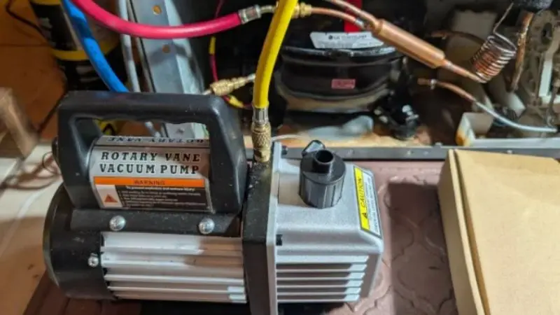 How long should you vacuum a refrigerator system