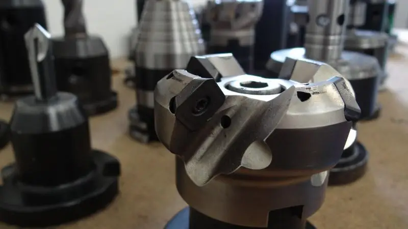What is a tool that drills holes and how does it work?