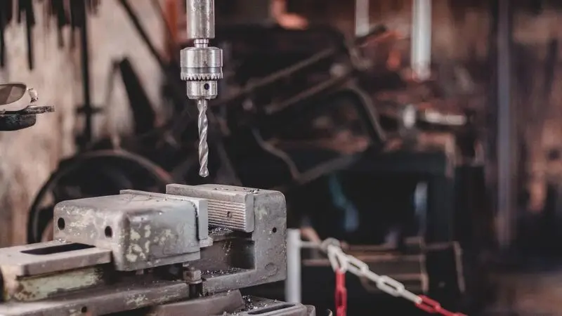 essential tools and safety gear for drilling a hole in a rock