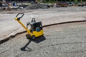 some tools and materials that are needed for compacting pavers
