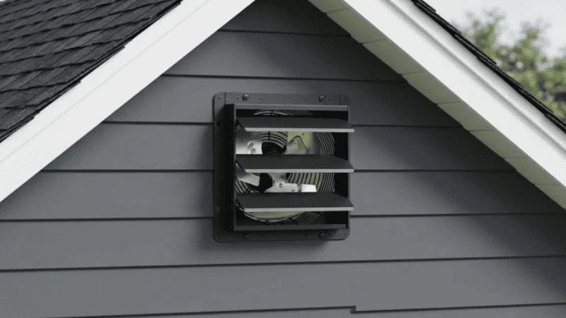 Gable attic fan installed view in a home
