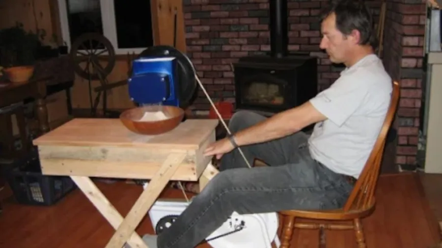 Manual small flour mill for home use in action
