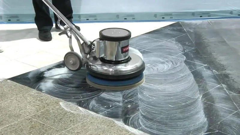 Concrete polishing machine on a decorative mirror-finish floor