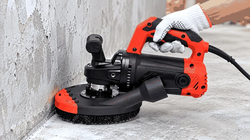 Handheld concrete grinder for edge grinding